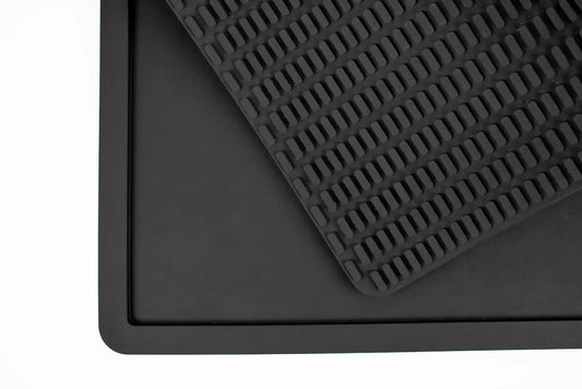 Close-up of the textured non-slip grip pad under the black Wolf Woman Essentials Silicone Feeding Placemat.